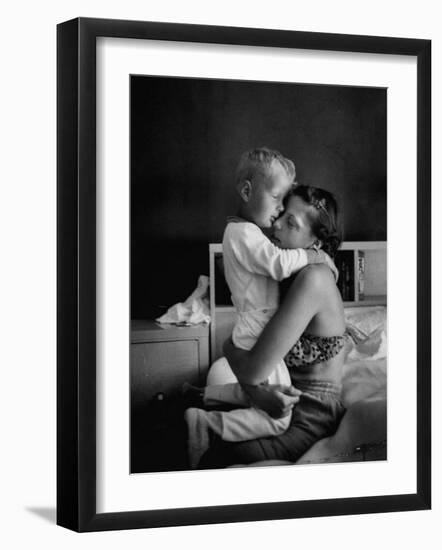 Young Mother Hugging One of Her Sons-Mark Kauffman-Framed Photographic Print