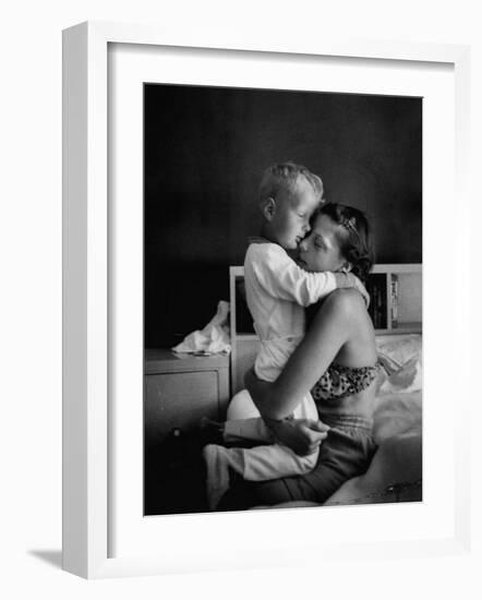 Young Mother Hugging One of Her Sons-Mark Kauffman-Framed Photographic Print