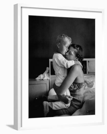 Young Mother Hugging One of Her Sons-Mark Kauffman-Framed Photographic Print