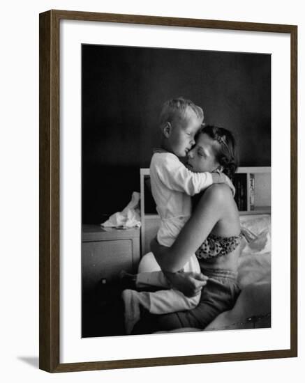 Young Mother Hugging One of Her Sons-Mark Kauffman-Framed Photographic Print