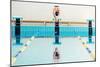 Young Muscular Swimmer Jumping from Starting Block in a Swimming Pool-NejroN Photo-Mounted Photographic Print