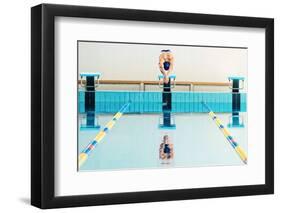 Young Muscular Swimmer Jumping from Starting Block in a Swimming Pool-NejroN Photo-Framed Photographic Print