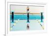 Young Muscular Swimmer Jumping from Starting Block in a Swimming Pool-NejroN Photo-Framed Photographic Print