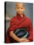 Young Myanmar Buddhist Monk Smiles Broadly as He Waits for Donations Early on a Yangon Street-null-Stretched Canvas