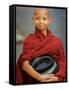 Young Myanmar Buddhist Monk Smiles Broadly as He Waits for Donations Early on a Yangon Street-null-Framed Stretched Canvas