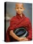 Young Myanmar Buddhist Monk Smiles Broadly as He Waits for Donations Early on a Yangon Street-null-Stretched Canvas