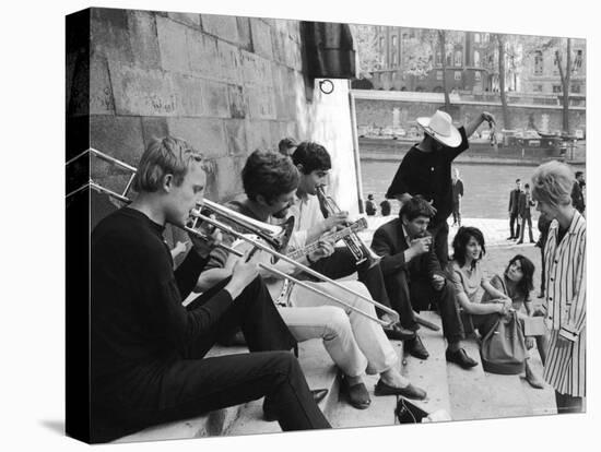 Young Parisian Musicians Enjoying an Impromptu Outdoor Concert on the Banks of the Seine River-Alfred Eisenstaedt-Stretched Canvas