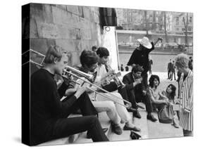 Young Parisian Musicians Enjoying an Impromptu Outdoor Concert on the Banks of the Seine River-Alfred Eisenstaedt-Stretched Canvas