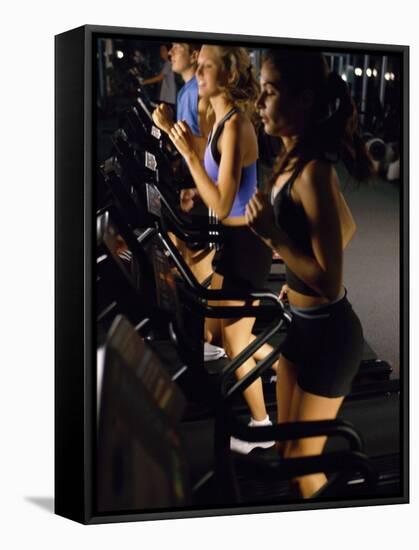 Young People Running on Treadmills in a Gym-null-Framed Stretched Canvas