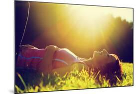 Young Pretty Woman Lying on the Grass at Summer Sunset-Michal Bednarek-Mounted Photographic Print