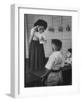 Young School Teacher Explaining to a Little Chinese Boy the Writings on Card That She Is Holding-null-Framed Photographic Print