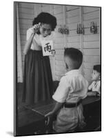 Young School Teacher Explaining to a Little Chinese Boy the Writings on Card That She Is Holding-null-Mounted Photographic Print