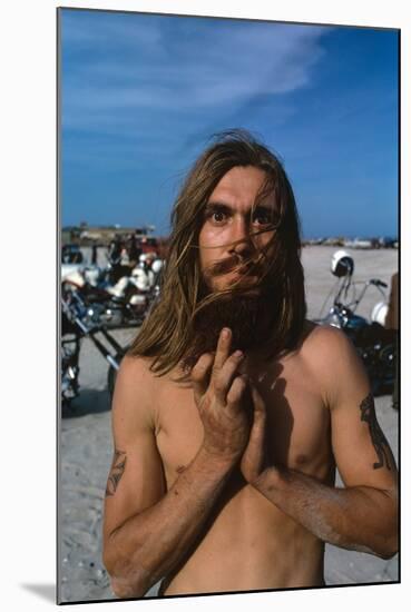 Young Shirtless Man with Long Flowing Hair-Mario de Biasi-Mounted Photographic Print