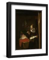 Young Woman at a Cradle, 1652 - 1662-Nicolaes Maes-Framed Art Print