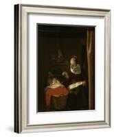 Young Woman at a Cradle, 1652 - 1662-Nicolaes Maes-Framed Art Print