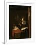 Young Woman at a Cradle, 1652 - 1662-Nicolaes Maes-Framed Art Print