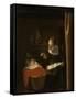 Young Woman at a Cradle, 1652 - 1662-Nicolaes Maes-Framed Stretched Canvas