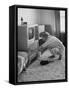 Young Woman Attending to Her Housework by Dusting Off Her Television Set-Nina Leen-Framed Stretched Canvas