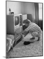 Young Woman Attending to Her Housework by Dusting Off Her Television Set-Nina Leen-Mounted Photographic Print