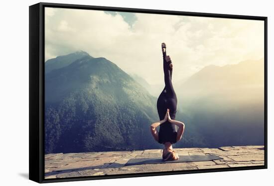 Young Woman Doing Complex Yoga Exercise Headstand with Namaste Asana. Amazing Yoga Landscape in Bea-AnnaTamila-Framed Stretched Canvas