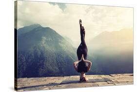 Young Woman Doing Complex Yoga Exercise Headstand with Namaste Asana. Amazing Yoga Landscape in Bea-AnnaTamila-Stretched Canvas