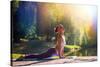 Young Woman Doing Yoga in Morning Park-lkoimages-Stretched Canvas