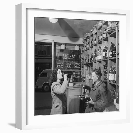Young Woman Drinking a Bottle of Coca Cola in a Shop, Paris, France, 1950-Mark Kauffman-Framed Photographic Print