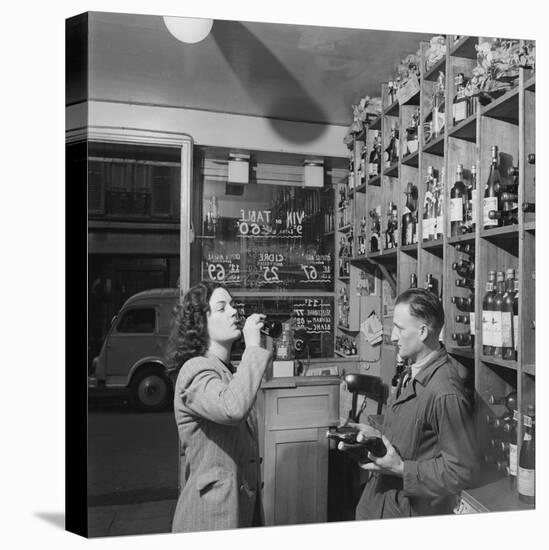 Young Woman Drinking a Bottle of Coca Cola in a Shop, Paris, France, 1950-Mark Kauffman-Stretched Canvas