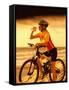 Young Woman Drinking Water Sitting on a Bicycle-null-Framed Stretched Canvas