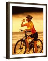 Young Woman Drinking Water Sitting on a Bicycle-null-Framed Premium Photographic Print