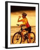 Young Woman Drinking Water Sitting on a Bicycle-null-Framed Photographic Print