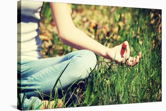 Young Woman during Relaxation and Meditation in Park Meditation Session. Frame Shows Half of Body.-B-D-S-Stretched Canvas