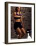 Young Woman Exercising on a Stationary Bike Checking her Heart Rate-null-Framed Photographic Print