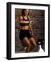 Young Woman Exercising on a Stationary Bike Checking her Heart Rate-null-Framed Photographic Print