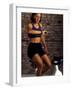 Young Woman Exercising on a Stationary Bike Checking her Heart Rate-null-Framed Photographic Print