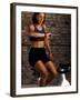 Young Woman Exercising on a Stationary Bike Checking her Heart Rate-null-Framed Photographic Print