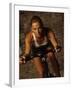 Young Woman Exercising on a Stationary Bike-null-Framed Photographic Print