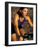 Young Woman Exercising on a Stationary Bike-null-Framed Photographic Print