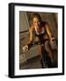 Young Woman Exercising on a Stationary Bike-null-Framed Photographic Print