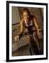 Young Woman Exercising on a Stationary Bike-null-Framed Photographic Print