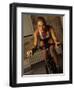 Young Woman Exercising on a Stationary Bike-null-Framed Photographic Print