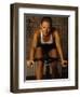 Young Woman Exercising on a Stationary Bike-null-Framed Photographic Print