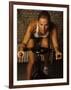 Young Woman Exercising on a Stationary Bike-null-Framed Photographic Print