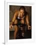 Young Woman Exercising on a Stationary Bike-null-Framed Photographic Print