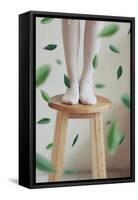 Young Woman Feet in Socks on a Stool-Carolina Hernandez-Framed Stretched Canvas