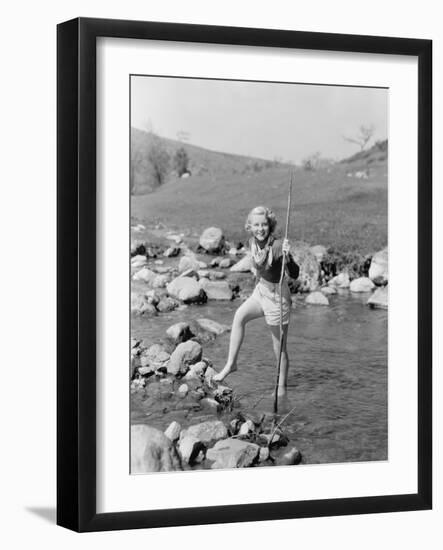 Young Woman Hiking Through a Stream of Water-null-Framed Photo