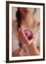 Young Woman Holding a Small Pink Flower-Carolina Hernandez-Framed Photographic Print