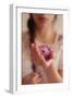 Young Woman Holding a Small Pink Flower-Carolina Hernandez-Framed Photographic Print