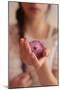 Young Woman Holding a Small Pink Flower-Carolina Hernandez-Mounted Photographic Print