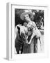 Young Woman in a Cowboy Hat Holding a Goat While Leaning Against Her Pony-null-Framed Photo